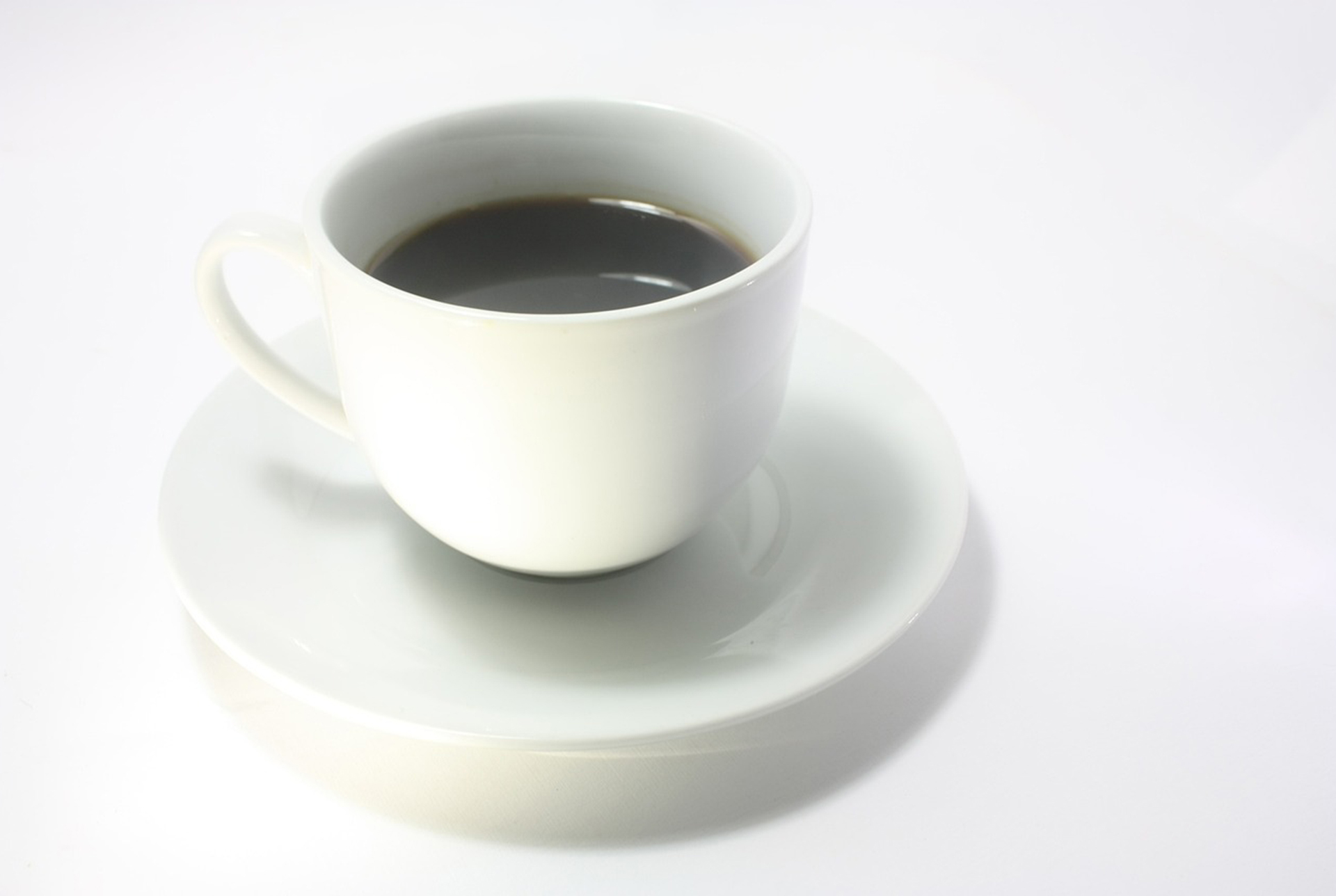 Americano in white cup on white background